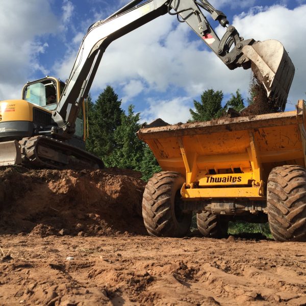 muck shift services cheshire 1 digger 1 other yellow vehicle moving dirt